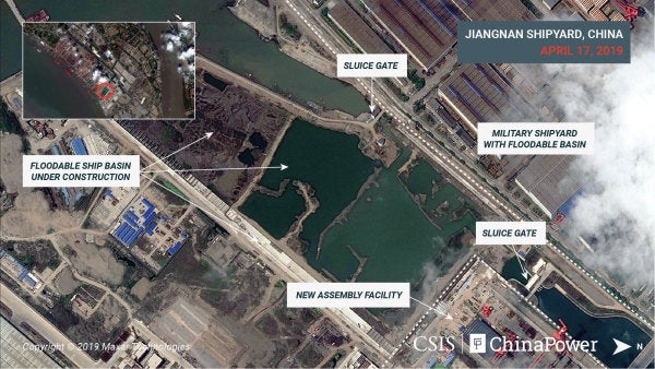 New satellite photos show China is building its third and largest aircraft carrier