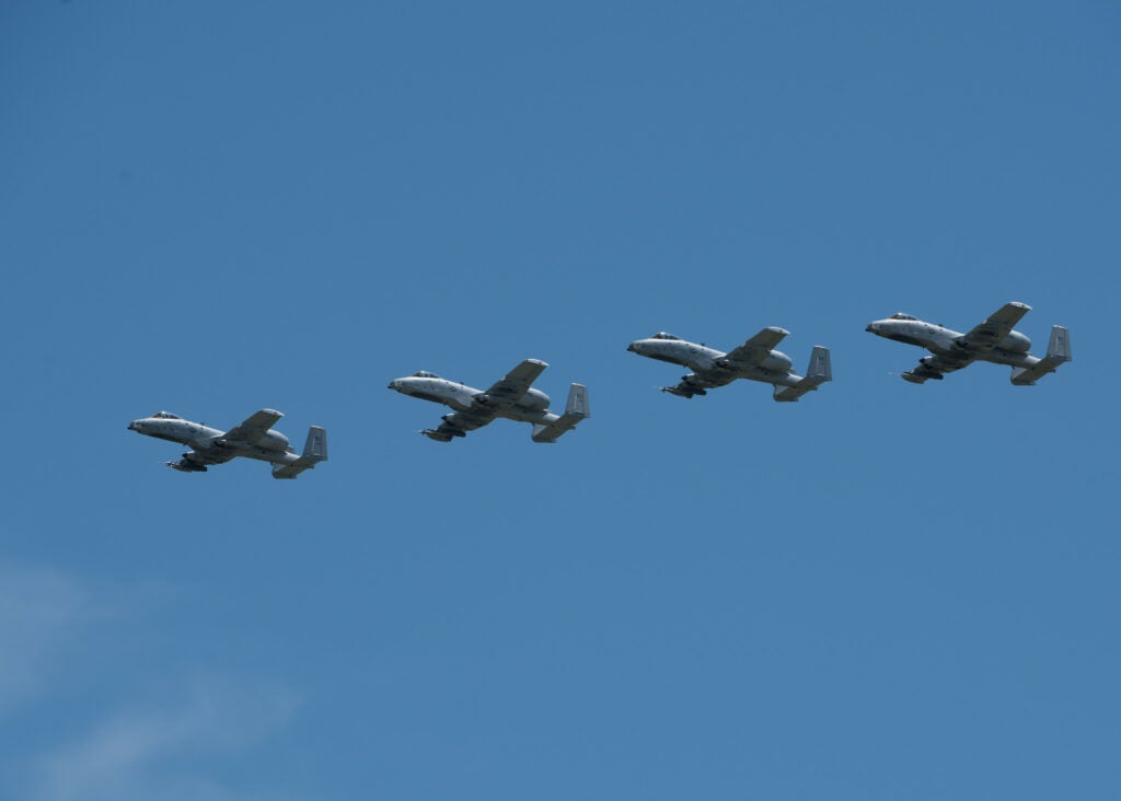 Four A-10 Thunderbolt IIs with the 442nd Fighter Wing fly in formation during the Wings Over Whiteman airshow on June 15, 2019, at Whiteman Air Force Base, Missouri.  (U.S. Air Force/ Airman 1st Class Parker J. McCauley)