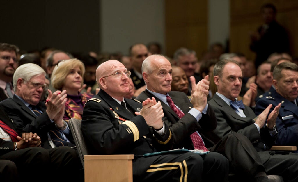 U.S. Army Maj. Gen. Gregg F. Martin, front row, left, the president of the National Defense University, applauds with other audience members as Secretary of Defense Chuck Hagel delivers remarks at the university at Fort Lesley J. McNair in Washington, D.C., April 3, 2013. Hagel spoke about the strategic and fiscal challenges facing the Department of Defense to an audience of roughly 600 faculty members, students and other attendees. (DOD photo by Glenn Fawcett/Released)