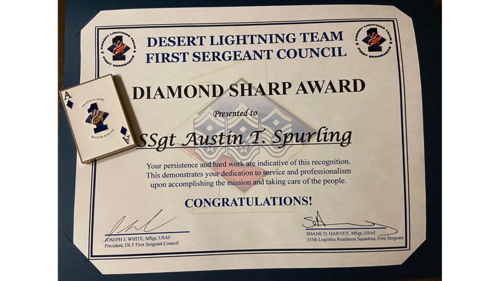 Staff Sgt. Austin Spurling was recognized for taking care of his airmen with an award and a special card-shaped challenge coin on March 10, 2021 at Davis-Monthan Air Force Base (Facebook photo)