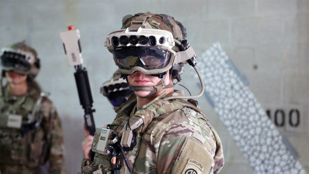 Soldiers don the Capability Set 3 (CS3) militarized form factor prototype of the Army’s Integrated Visual Augmentation System (IVAS) and wield a Squad immersive Virtual Trainer (SiVT) during a training environment test event at its third Soldier Touchpoint (STP 3) at Fort Pickett, Virginia