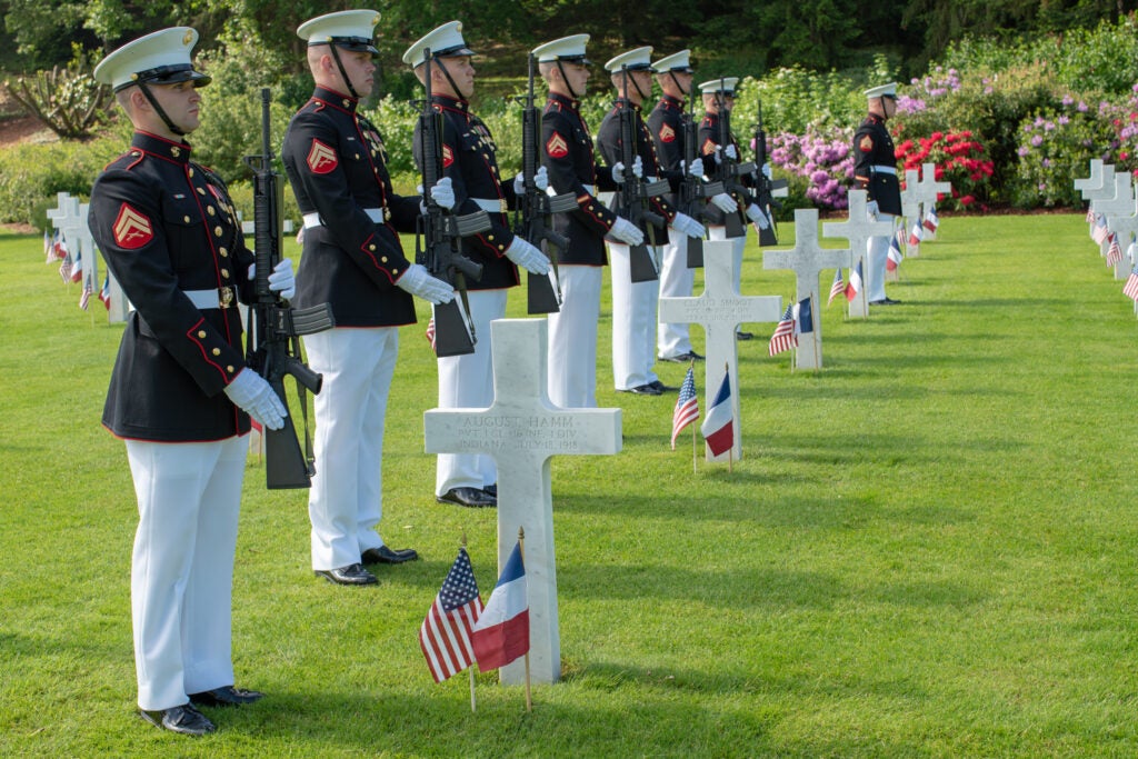 U.S. Marines with 3rd Battalion, 5th Marine Regiment, stand at present arms during the Aisne-Marne Memorial Day ceremony at the Aisne-Marne American Cemetery near Belleau, France, May 26, 2019. The ceremony was held in commemoration of the 101st anniversary of the battle of Belleau Wood, conducted to honor the legacy of service members who gave their lives in defense of the United States and European allies. (U.S. Marine Corps photo by Lance Cpl. Menelik Collins)