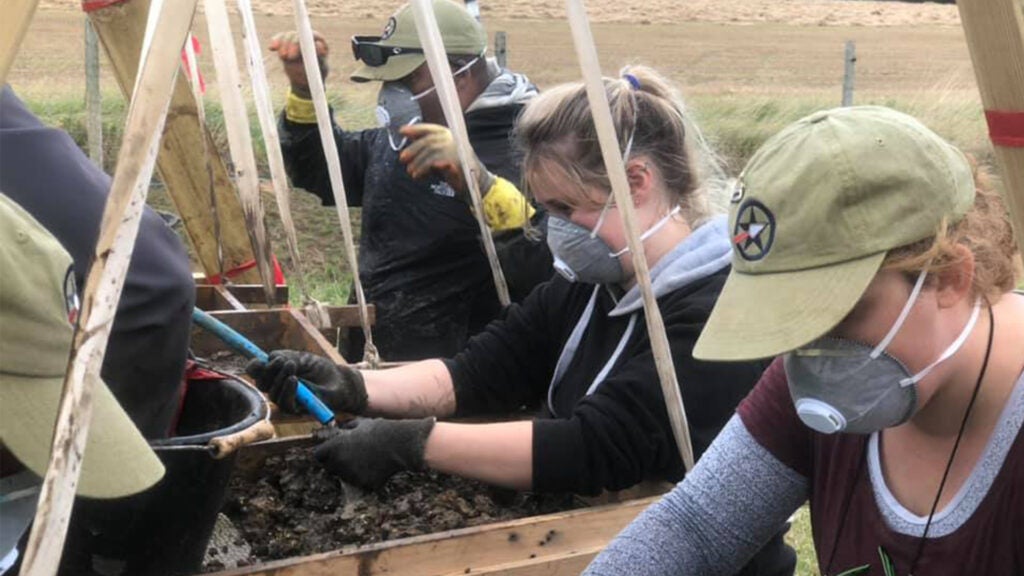 AVAR participants screen through dense clay sub-soil while excavating for a crashed WWII B-24H Liberator bomber in the United Kingdom in 2019. (Facebook / AVAR photo)