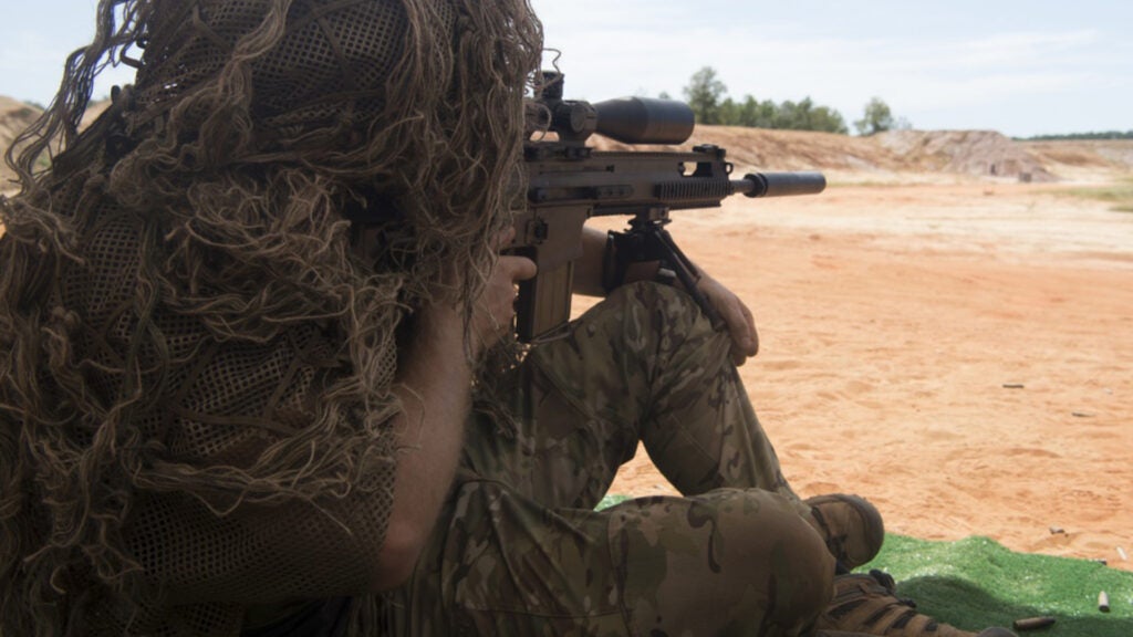 A U.S. Air Force Special Tactics operator fires his weapon during long-range weapons training as part of a beta Special Reconnaissance training course near Hurlburt Field, Florida, Sept. 20, 2019. The Special Tactics Training Squadron conducted the course to identify specific core tasks required for each skill level of the new SR career field. (U.S. Air Force photo by Master Sgt. Jason Robertson)