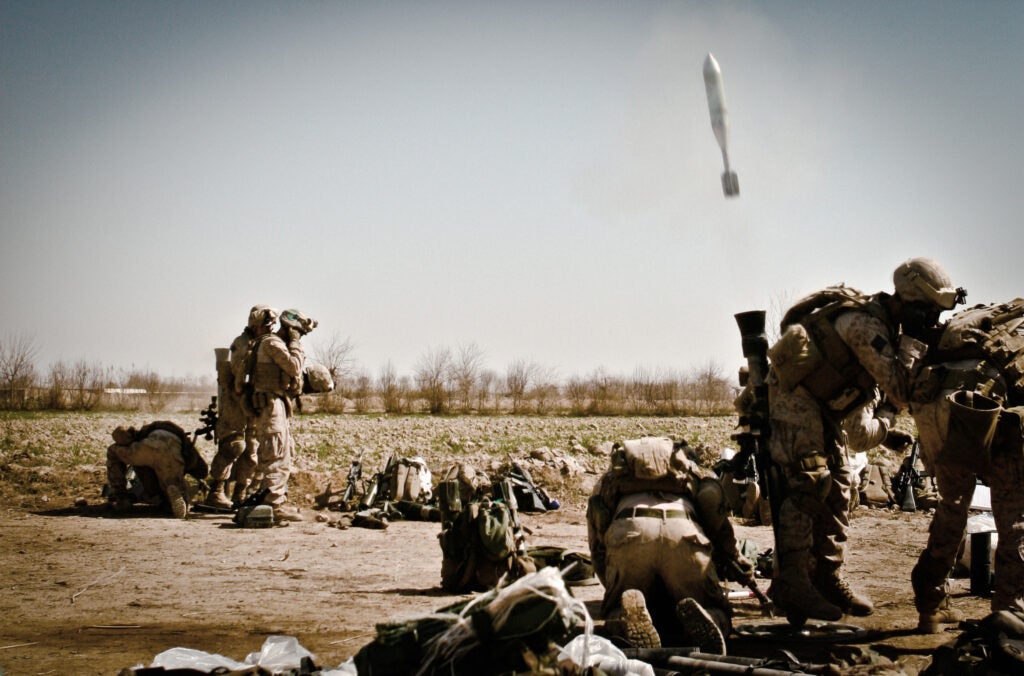 81mm mortar Marines with 1st Battalion, 6th Marine Regiment fire rounds during the Battle of Marjah on Feb. 13, 2010. (U.S. Marine Corps photo by James Clark.)