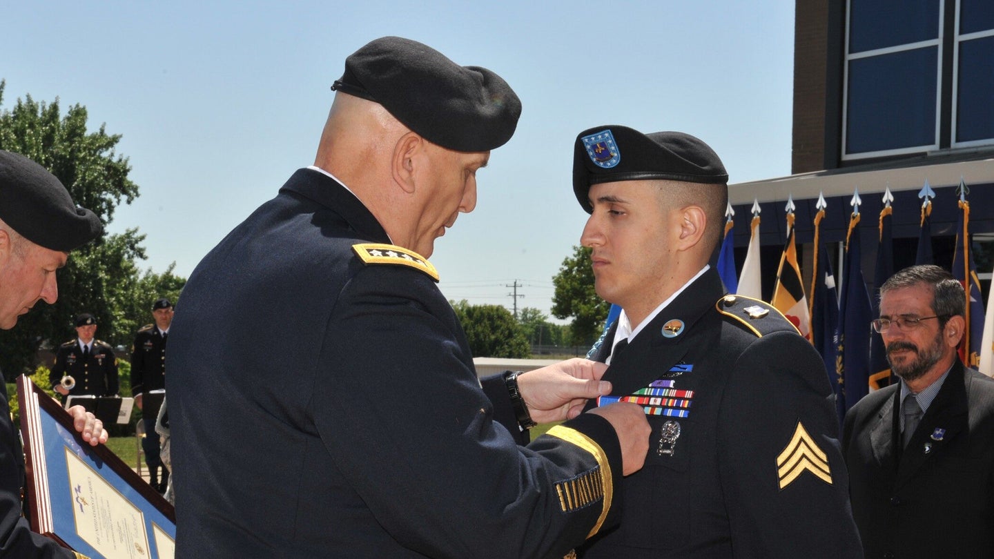 Then-Chief of Staff of the Army Gen. Raymond T. Odierno presents 101st Airborne Division (Air Assault) soldier Sgt. Felipe Pereira with a Distinguished Service Cross, April 12, 2012, at McAuliffe Hall at Fort Campbell, Kentucky. (U.S. Army)
