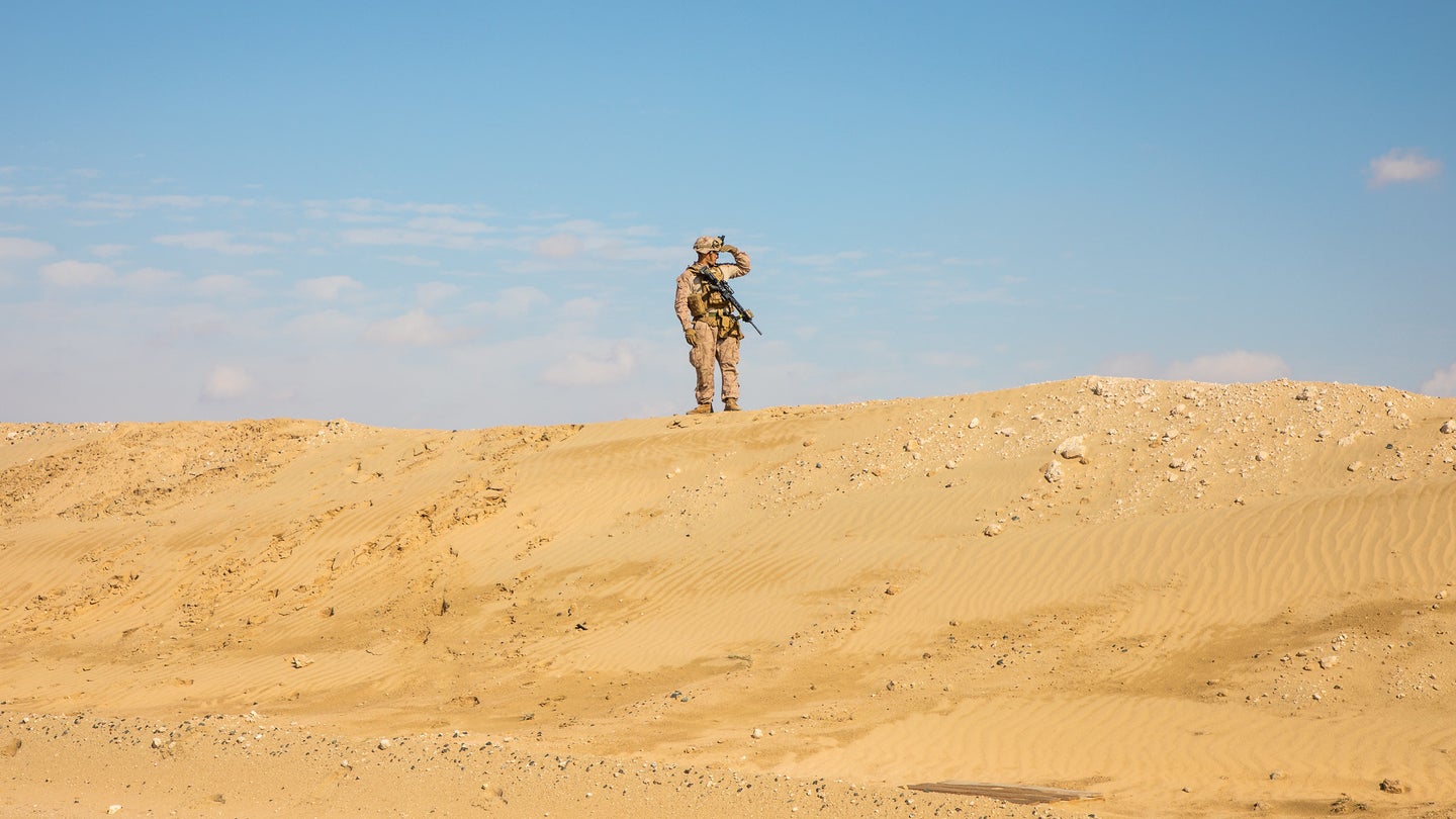 A Marine with 2nd Battalion, 7th Marines, assigned to the Special Purpose Marine Air-Ground Task Force – Crisis Response – Central Command (SPMAGTF-CR-CC) 19.2, provides overhead security during primary weapon training in Kuwait, Dec. 8, 2019. (Sgt. Kyle C. Talbot/U.S. Marine Corps)