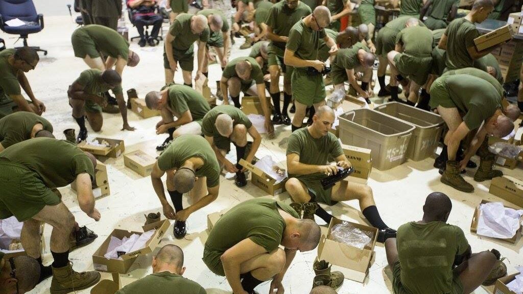 Recruits of Platoon 2098, Echo Company, 2nd Recruit Training Battalion, try on dress shoes Oct. 29, 2015, on Parris Island, South Carolina. (U.S. Marine Corps)