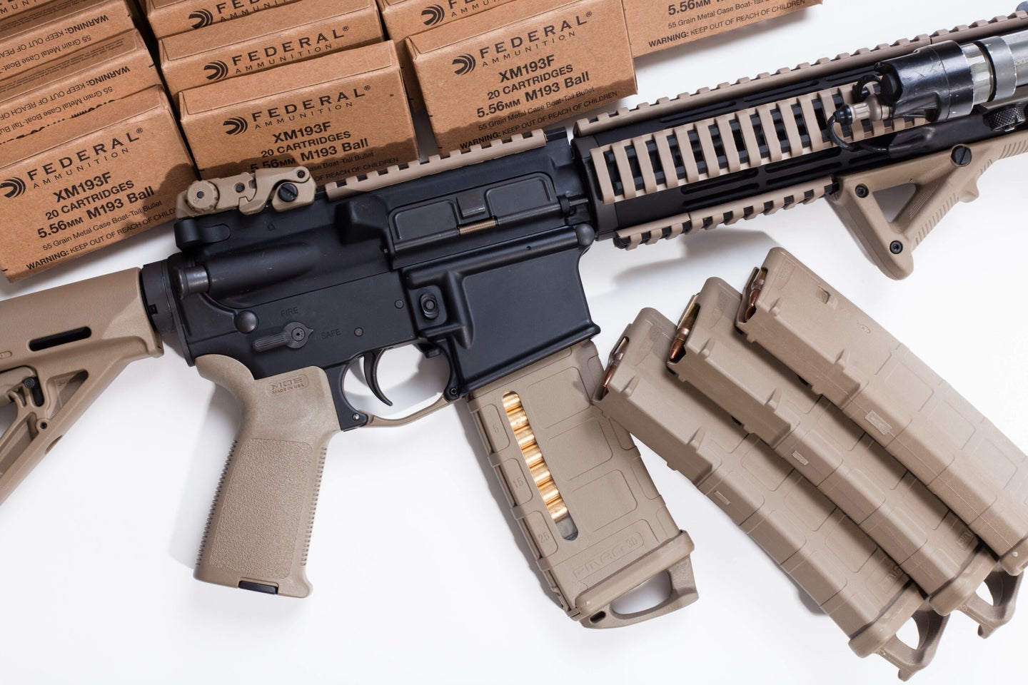 An AR-15 rifle and magazines.