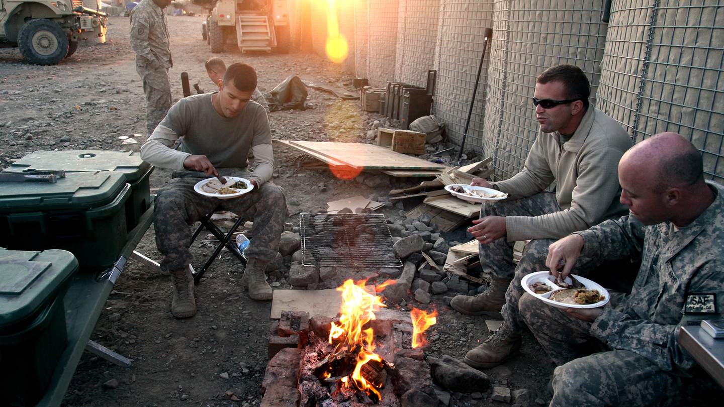 U.S. Army Soldiers eat their Thanksgiving meal on Combat Outpost Cherkatah, Khowst province, Afghanistan, Nov. 26, 2009. The Soldiers are deployed with Company D, 3rd Battalion, 509th Infantry Regiment. 