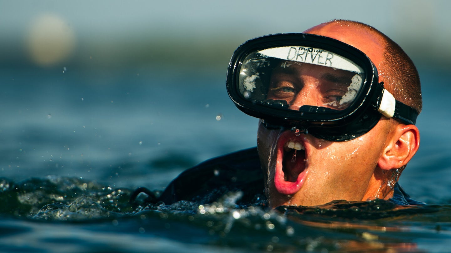 An Air Force Pararescue Jumper trainee swims to the finish point, Aug. 17, 2011, at Calaveras Lake, Texas. During a lake confidence course, trainees must swim 1,000 meters within 25 minutes to pass. PJ training accomplished at Lackland AFB, Texas, includes physiological training, obstacle course, marches, dive physics, dive tables, metric manipulations, medical terminology, cardiopulmonary resuscitation, weapons qualifications, PJ history and leadership reaction course. (U.S. Navy)
