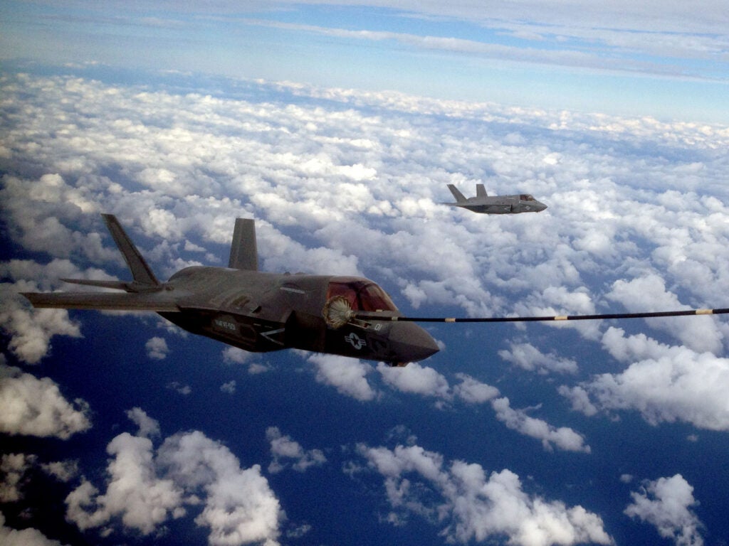 Two F-35B Joint Strike Fighters conduct the first aerial refueling of its kind with a KC-130J Hercules in the sky above Eglin Air Force Base, Fla., Oct. 2. Previous aerial refueling operations with the F-35 had been conducted with test aircraft. "It's great to start to expand our operational capability in the context of working with the Marine Air-Ground Task Force," said Lt. Col. David Berke, who commands the F-35B squadron, Marine Fighter Attack Training Squadron 501, at Eglin. The KC-130J was from Marine Aerial Refueler Transport Squadron 252, based out of Marine Corps Air Station Cherry Point, N.C.