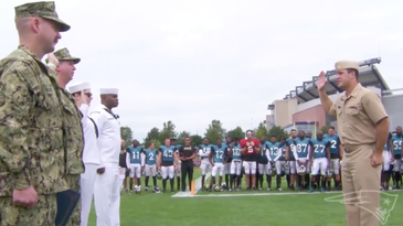 New England Patriots Player And Navy Ensign Performs Reenlistment Ceremony For Fellow Sailors