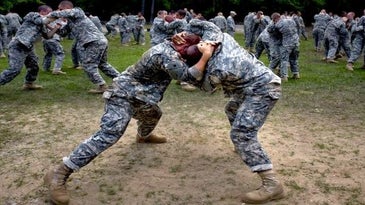 Army basic trainees practice hand-to-hand combat