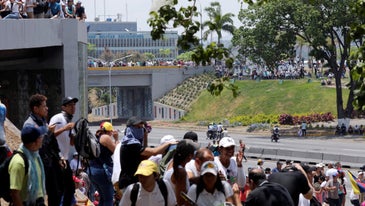 Thousands take to the streets in Venezuela to force Maduro from power