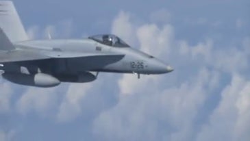 Watch a Russian jet chase a NATO fighter away from the Russian defense minister's aircraft