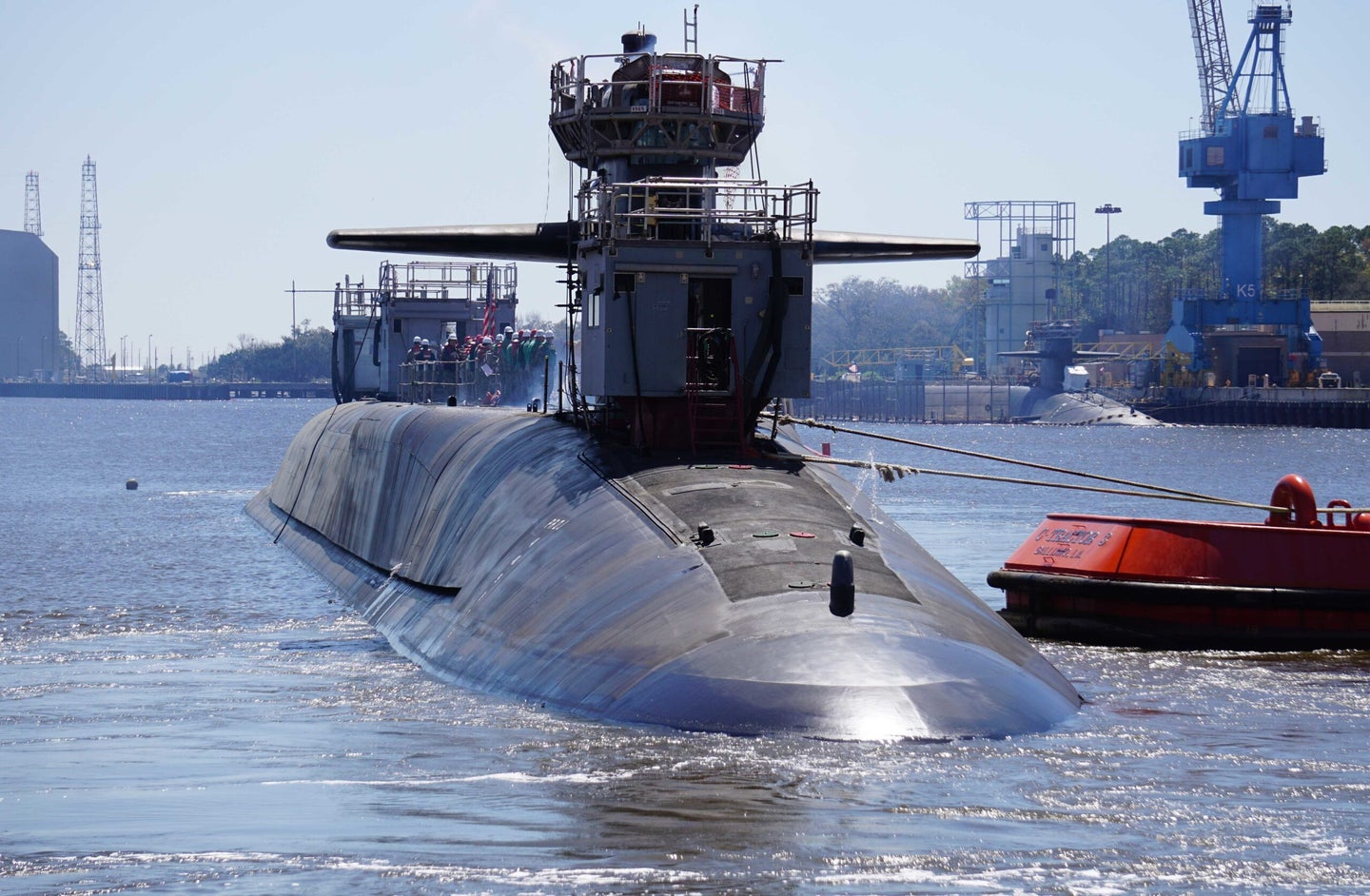The Ohio-class guided-missile submarine USS Georgia (SSGN 729) exits the dry dock at Naval Submarine Base Kings Bay, Ga., following an extended refit period. 