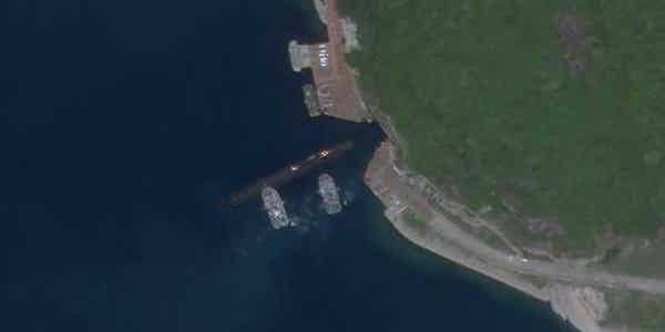 Satellite photo appears to show Chinese submarine using secretive underwater cave at South China Sea base
