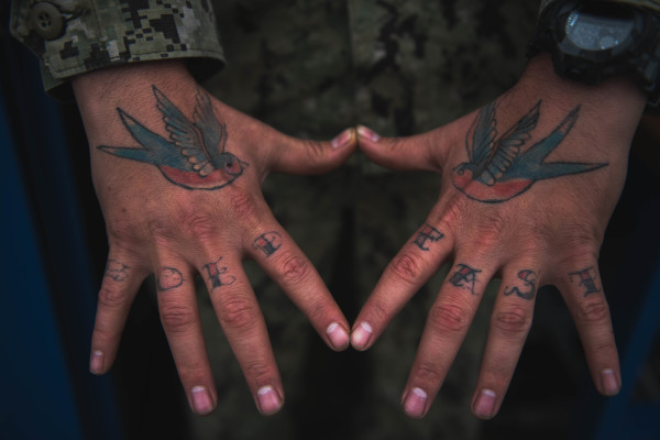 The Navy is considering opening tattoo parlors on its bases in Hawaii and Guam