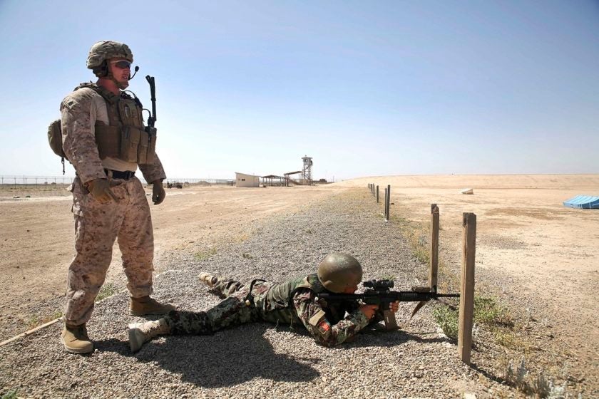 A Marine with Task Force Southwest observes an Afghan National Army soldier with the Helmand Regional Military Training Center fire an M4 carbine at Camp Shorabak, Afghanistan, May 11, 2017. In preparation for the Task Force’s first operational readiness cycle, approximately 15 Marine advisors practiced firing and proper range protocol with Afghan RMTC trainers. The ORC, which is scheduled to begin May 20, is designed to enhance the warfighting capabilities of more than 600 soldiers with the 2nd Kandak, 4th Brigade to build security and stability throughout Helmand Province. (U.S. Marine Corps photo by Sgt. Lucas Hopkins)