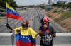 Thousands take to the streets in Venezuela to force Maduro from power