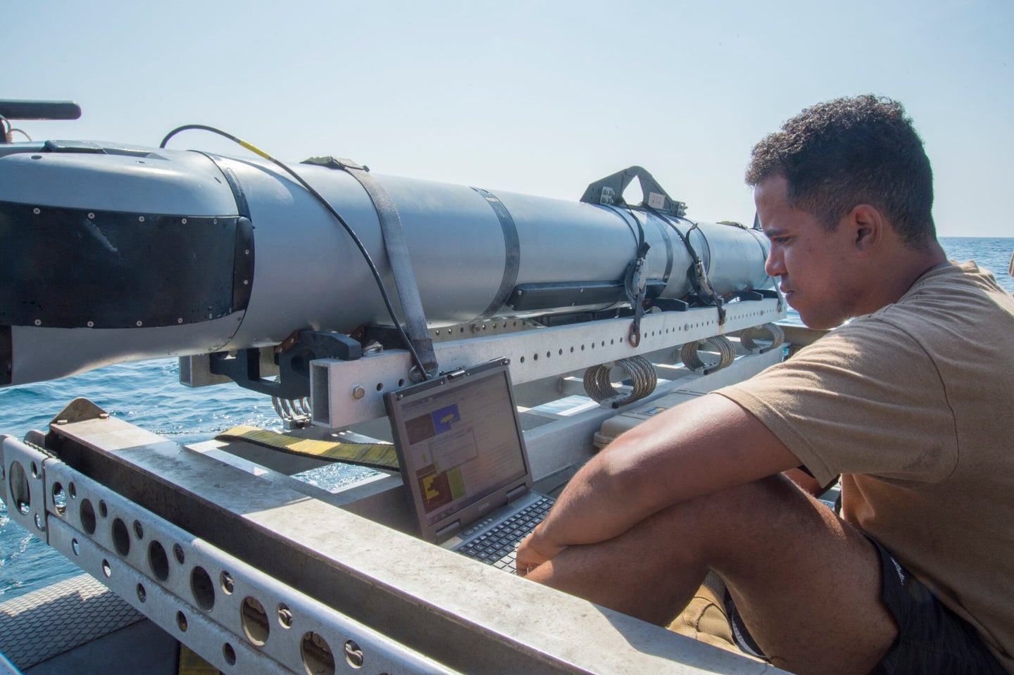 151027-N-JC374-058 ARABIAN GULF (Oct. 27, 2015) Mineman 3rd Class John Stephen-Torres, assigned to Commander, Task Group (CTG) 56.1, observes data from a MK 18 MOD 2 unmanned underwater vehicle (UUV) for a training evolution during a squadron exercise (SQUADEX). (U.S. Navy photo by Mass Communication Specialist 3rd Class Jonah Stepanik/Released)