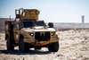 A U.S. Marine drives a Joint Light Tactical Vehicles at White Beach as part of the I Marine Expeditionary Force JLTV Operator New Equipment Training course on Marine Corps Base Camp Pendleton, California, Oct. 24, 2019. The beach training teaches Marines how to operate JLTVs on different types of terrain. The JLTV OPNET course is an eight-day training evolution teaching students the vehicle’s characteristics, operations, operator maintenance and safety. (U.S. Marine Corps photo by Lance Cpl. Drake Nickels)