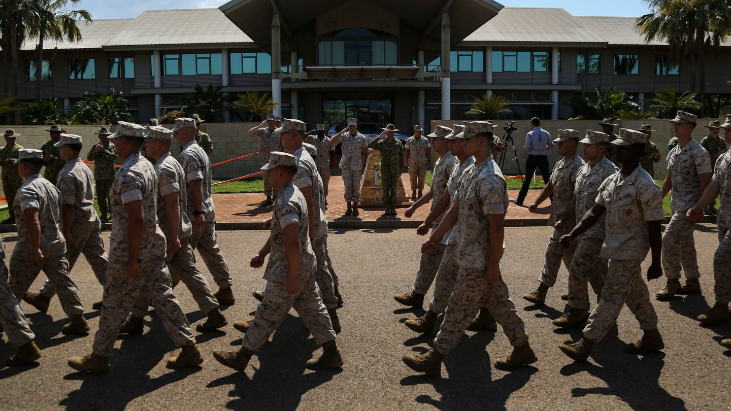 U.S. Marine Corps Maj. Gen. Richard Simcock and Australian Brig. Mick Ryan salute Marines with 1st Battalion, 4th Marine Regiment, Marine Rotational Force – Darwin, as they pass in review Oct. 5 at the end of a farewell ceremony hosted by 1st Brigade, Australian Army, at Robertson Barracks, Northern Territory, Australia. (Cpl. Angel Serna/U.S. Marine Corps)