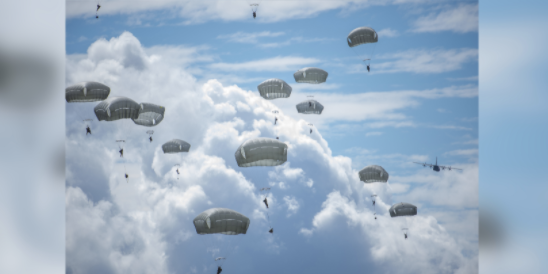 Watch over 300 Army paratroopers drop into Guam just to remind folks who’s boss