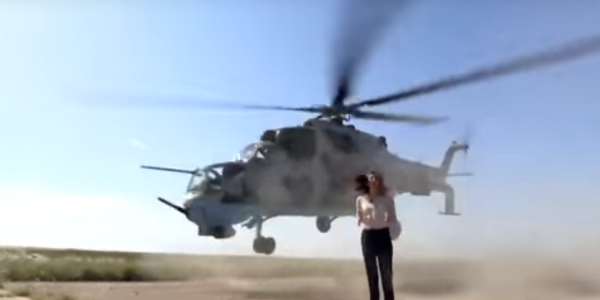 TV Broadcaster Completely Unfazed As Attack Helicopter Nearly Takes Her Head Off