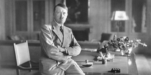 Hitler Sitting on Desk