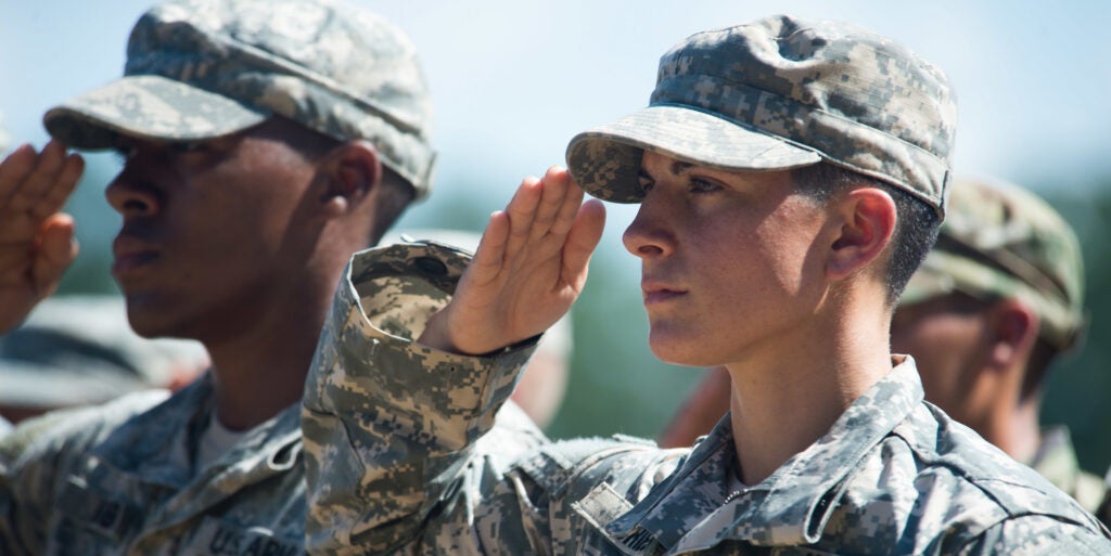 Capt. Kristen Griest and U.S. Army Ranger School Class 08-15 render a salute during their graduation at Fort Benning, Ga., Aug. 21, 2015. Griest and class member 1st Lt. Shaye Haver became the first female graduates of the school.  (U.S. Army photo by Staff Sgt. Steve Cortez/ Released)