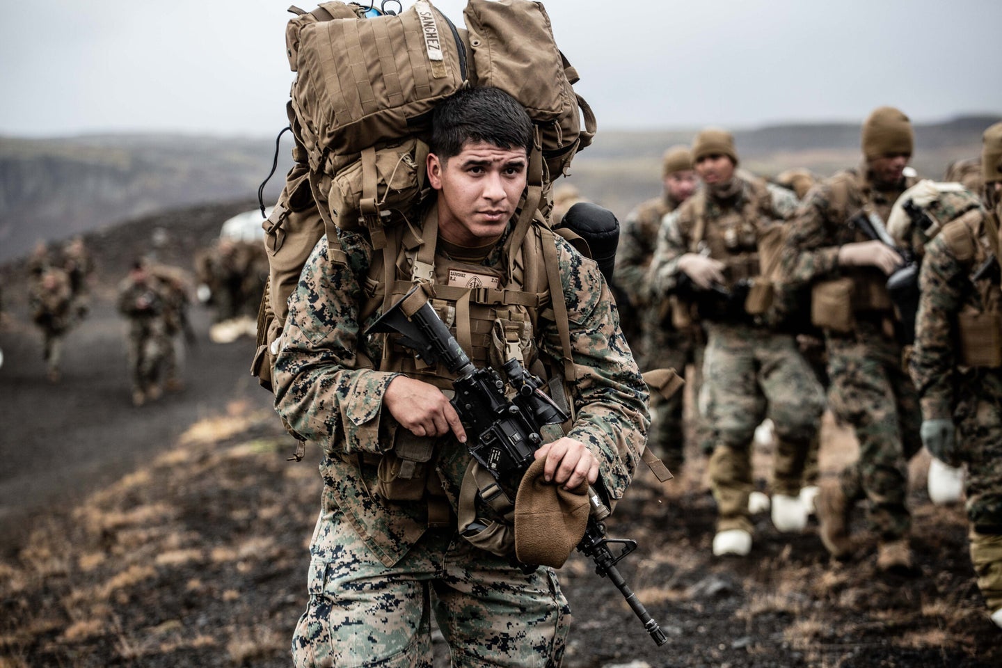 A U.S. Marine with the 24th Marine Expeditionary Unit (MEU) carries cold weather equipment as he begins to march across the Icelandic terrain October 19, 2018. The 24th MEU was in Iceland preparing for NATO Exercise Trident Juncture 2018. The main phase of Trident Juncture will start in Norway on October 25. The exercise will bring together around 50,000 personnel from all 29 Allies plus partners Finland and Sweden.



Photo by Jack Sommerville
