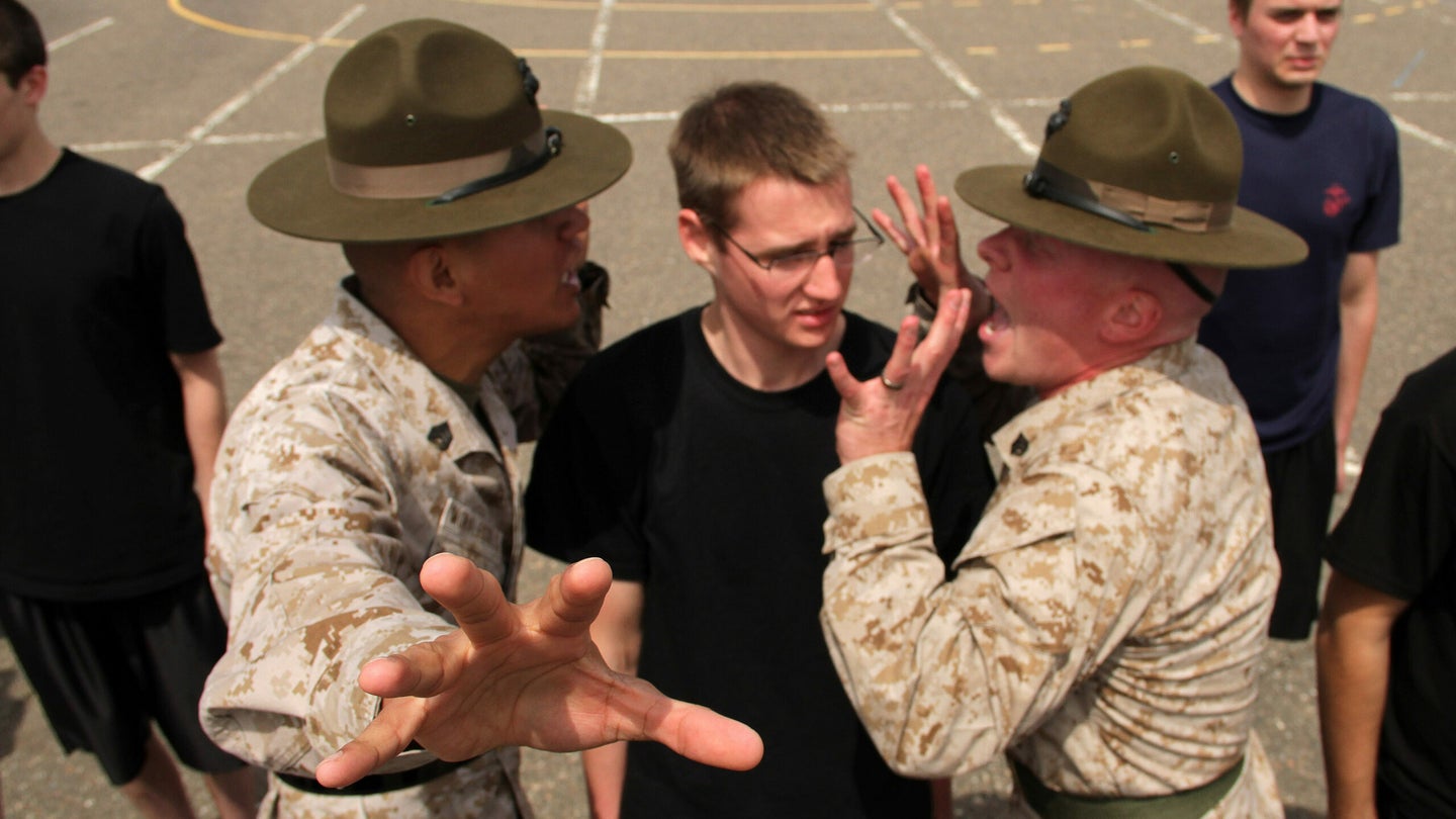 enior drill instructor Staff Sgt. Salvador Moralessolis and drill instructor Sgt. Bryce E. Torrence explain to David W. Brown III, 20, from Barnesville, Minn., that it’s not polite to look directly at them while attending the Recruiting Station Twin Cities mini boot camp in Minneapolis, Minnesota. (U.S. Marine Corps photo.)
