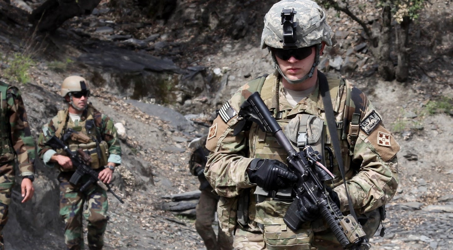 U.S. Army Soldiers of 2-12 Infantry Regiment conduct patrol outside Korengal Outpost during Operation Mountain Decent 2, April 6, 2010.