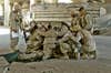 U.S. Marines pray over a fallen comrade at a first aid point after he died from wounds suffered in fighting in Fallujah, Iraq, Thursday, April 8, 2004. Hundreds of U.S. Marines have been fighting insurgents in several neighborhoods in the western Iraqi city of Fallujah in order to regain control of the city. This photograph is one in a portfolio of twenty taken by eleven different Associated Press photographers throughout 2004 in Iraq. The Associated Press won a Pulitzer prize in breaking news photography for the series of pictures of bloody combat in Iraq. The award was the AP's 48th Pulitzer. (AP Photo/Murad Sezer)
