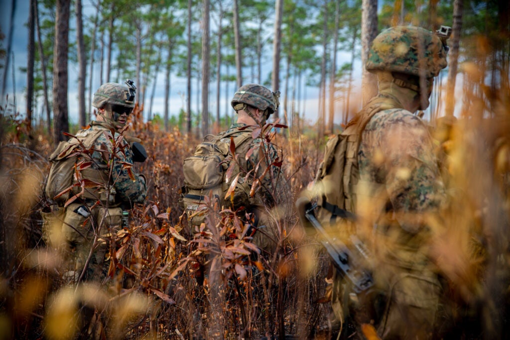 U.S. Marine Corps Lance Cpl. Colin Lybrand, left, Lance Cpl. Levi Kitchell, and Lance Cpl. Chase Gerber, right, all riflemen with India Company, 3rd Battalion, 6th Marine Regiment, 2d Marine Division, participate in live-fire assaults on range Golf-36 (G-36), Camp Lejeune, North Carolina, Dec. 12, 2020. Range G-36 is the newest addition to the Camp Lejeune training environment. This range is designed to accommodate company-size assaults and evolutions. (U.S. Marine Corps photo by Lance Cpl. Jacqueline Parsons)