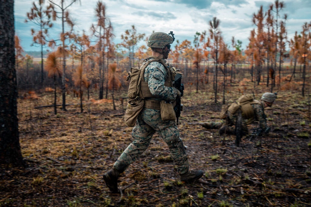 U.S. Marine Corps Lance Cpl. Elijah Eakins, a rifleman with India Company, 3rd Battalion, 6th Marine Regiment, 2d Marine Division, maneuvers through a live-fire assault on range Golf-36 (G-36), Camp Lejeune, North Carolina, Dec. 12, 2020. Range G-36 is the newest addition to the Camp Lejeune training environment. This range is designed to accommodate company-size assaults and evolutions. (U.S. Marine Corps photo by Lance Cpl. Jacqueline Parsons)