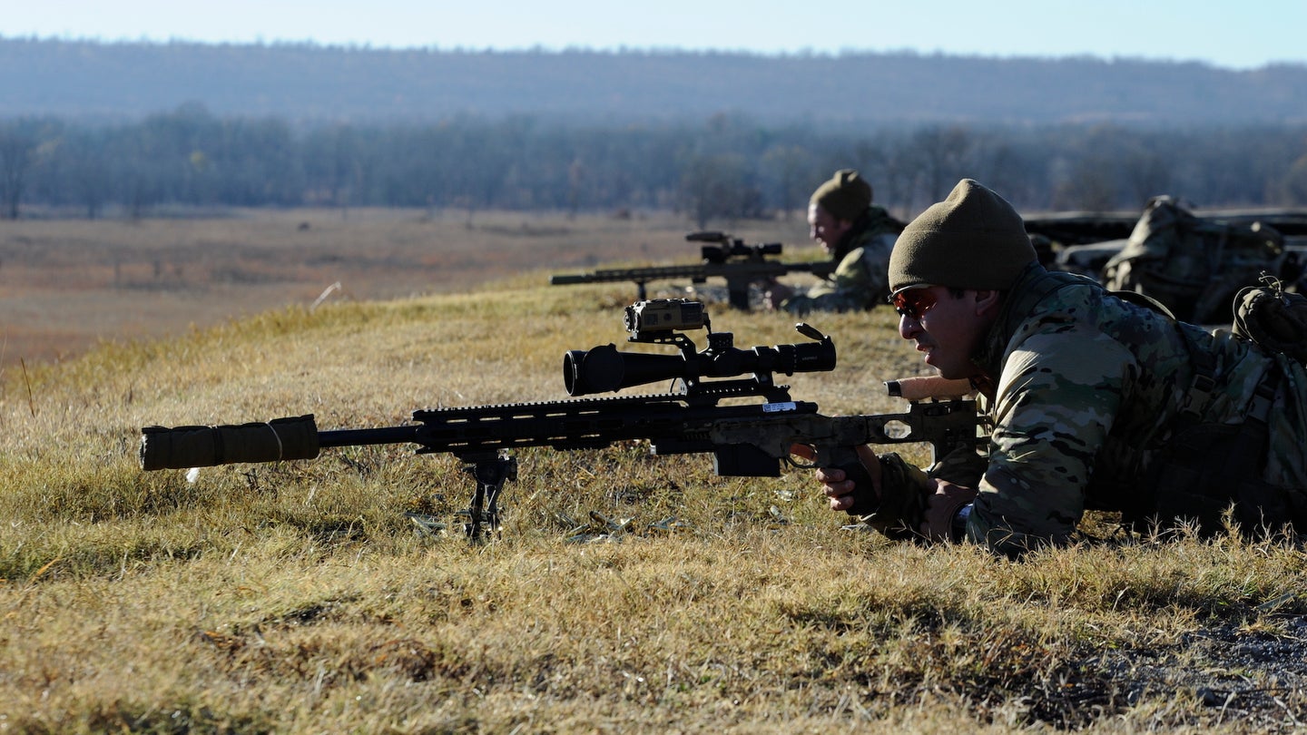Side by side the sniper teams remain calm and composed as they orient and strategically work together to attain their targets located at Fort Chaffee Arkansas December 5, 2020. (U.S. Army National Guard photo by Sgt. Israel Sanchez)