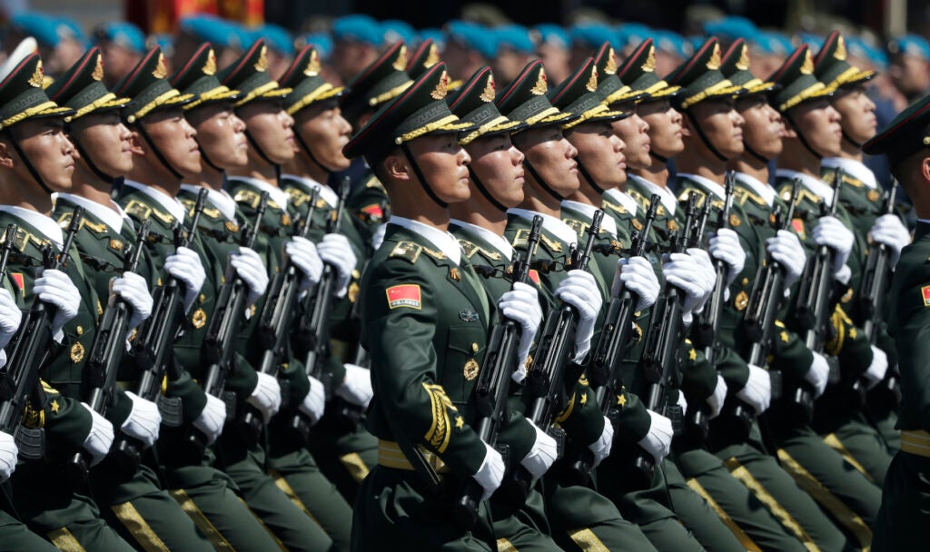 Soldiers from China's People's Liberation Army march toward Red Square during the Victory Day military parade marking the 75th anniversary of the Nazi defeat in Moscow, Russia, Wednesday, June 24, 2020. The Victory Day parade normally is held on May 9, the nation's most important secular holiday, but this year it was postponed due to the coronavirus pandemic. (AP Photo/Pavel Golovkin, Pool)