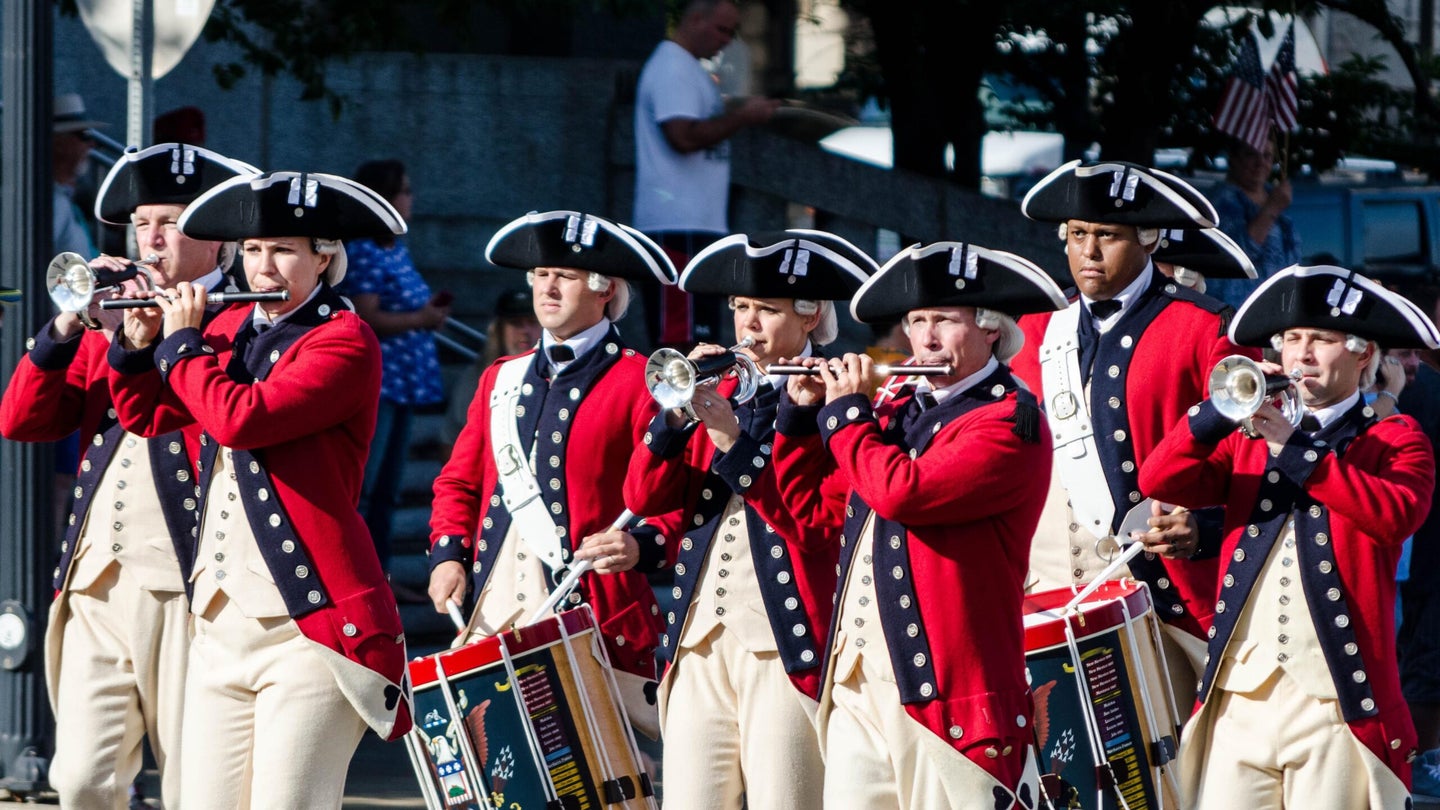 Participants dressed in uniforms from the American Revolution lead the Heroes Honoring Heroes Parade in Nashville, Tenn., Aug. 8, 2015.
