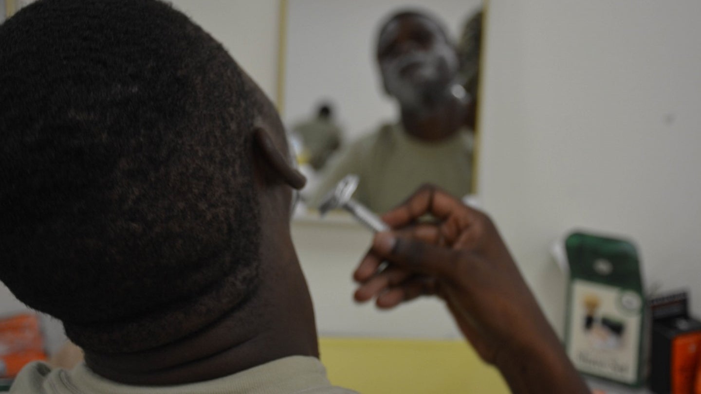 A Soldier assigned to the 3rd Infantry Division Sustainment Brigade uses a single-blade razor to shave his face during a shaving clinic May 22 at the brigade's organizational classroom (Army photo / Sgt. Caitlyn Smoyer)