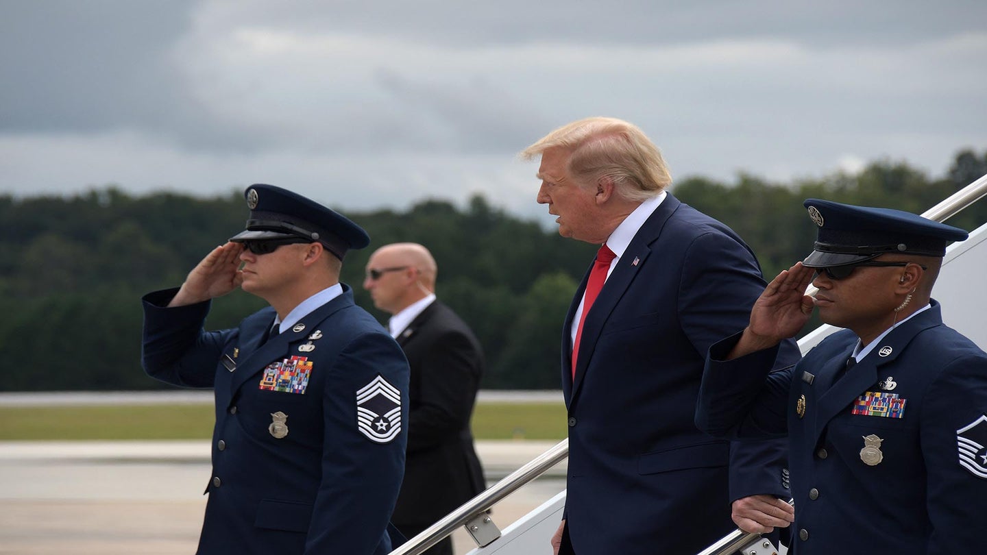 President Donald J. Trump speaks to official greeters as he steps off Air Force One at Dobbins Air Reserve Base, Ga. on Sep 25, 2020. The president transited through the base on his way to attend an engagement at the Cobb Galleria Center. (U.S. Air Force photo/Andrew Park)
