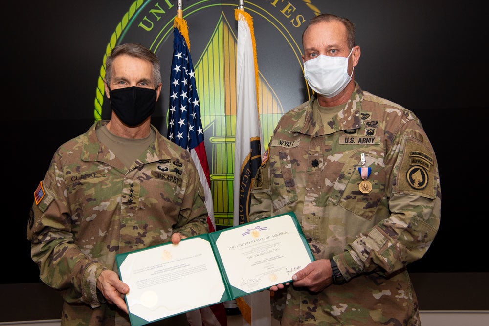 Gen. Richard D. Clarke, commander, U.S. Special Operations Command, presents Lt. Col. Larry Wyatt, USSOCOM clinic director, with a Soldier’s Medal at MacDill Air Force Base, Fla., Dec. 22, 2020. He was awarded the medal for delivering lifesaving care to two people after a motorcycle collided with bicyclists April 7, 2019, despite being injured himself. (U.S. Air Force photo by Air Force Master Sgt. Barry Loo)