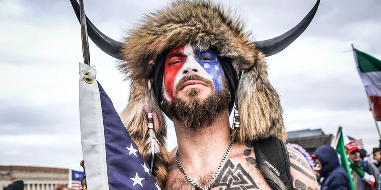 The ‘QAnon shaman’ guy got kicked out of the Navy for refusing a vaccine