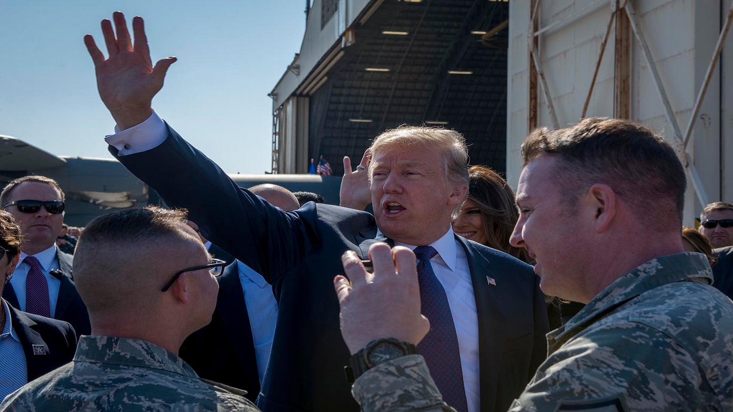President Donald J. Trump waves to service members and their families upon arriving to Japan, Nov. 5, 2017, at Yokota Air Base, Japan. This marked the first time Trump visited Japan as president. (U.S. Air Force photo by Senior Airman Donald Hudson)