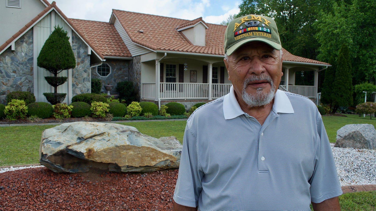 Sgt. Major Angel Macias, one of the original members of Delta Force, passed away earlier this year at the age of 80. He was photographed in front of his home near Parkton, North Carolina, for a 2017 feature in the Fayetteville Observer (Photo Courtesy The Fayetteville Observer / Roger Mercer)