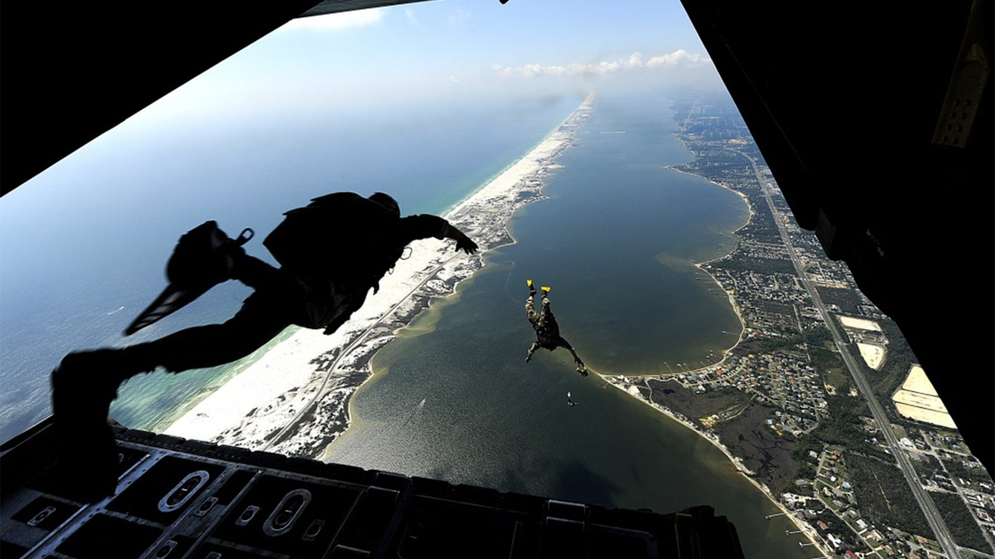 U.S. Air Force members from the 23rd Special Tactics Squadron, Air Force Special Operations Command, Hurlburt Field, Fla., jump out of the back of a C-130 Hercules Sept. 27, 2010. (Air Force photo / Master Sgt. Russell Cooley)