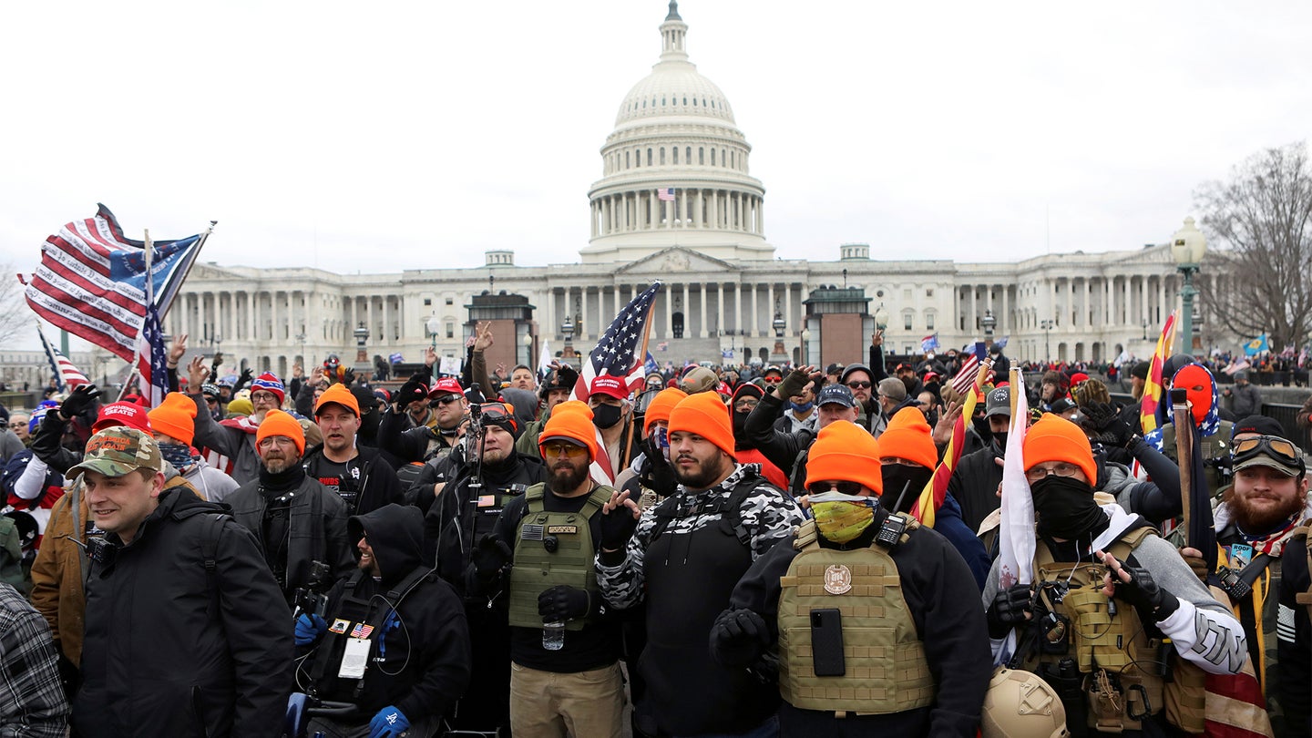 Members of the far-right group Proud Boys make 'OK' hand gestures indicating "white power" as supporters of U.S. President Donald Trump gather in front of the U.S. Capitol Building to protest against the certification of the 2020 U.S. presidential election results by the U.S. Congress, in Washington, U.S., January 6, 2021. (REUTERS/Jim Urquhart)