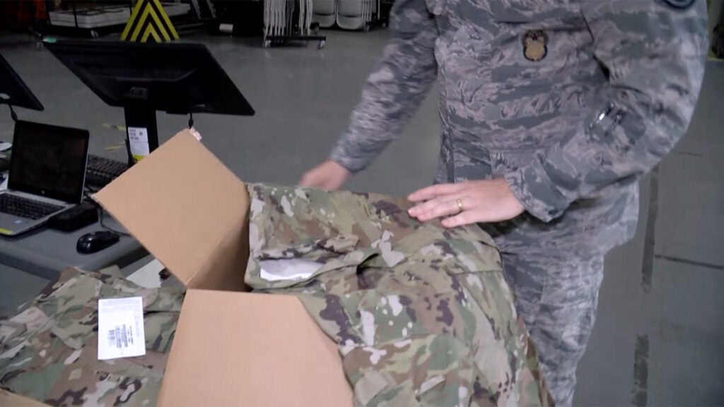 Members of the Iowa Air National Guard in Sioux City are issued new sets of Operational Camouflage Pattern uniforms in March 2020. (Air Force screenshot / Video by Senior Master Sgt. Vincent De Groot)